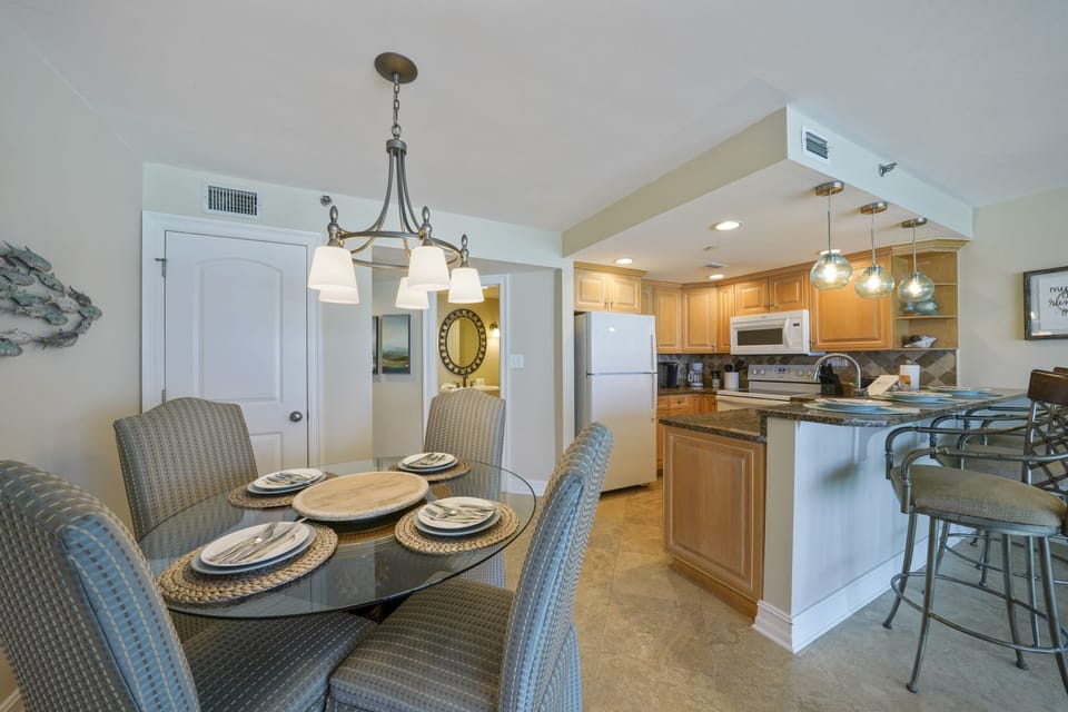 Dine comfortably at the glass top table or enjoy casual meals at the breakfast bar in this Gulf front Destin condo