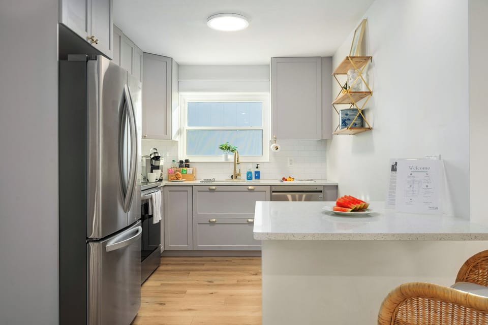 Fully stocked and freshly renovated kitchen with stainless steel appliances and space to cook gourmet meals
