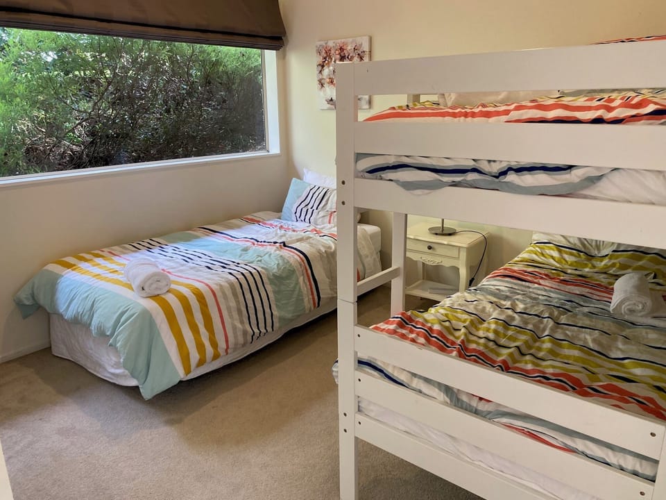 one king single bed plus a king single bunk bed 