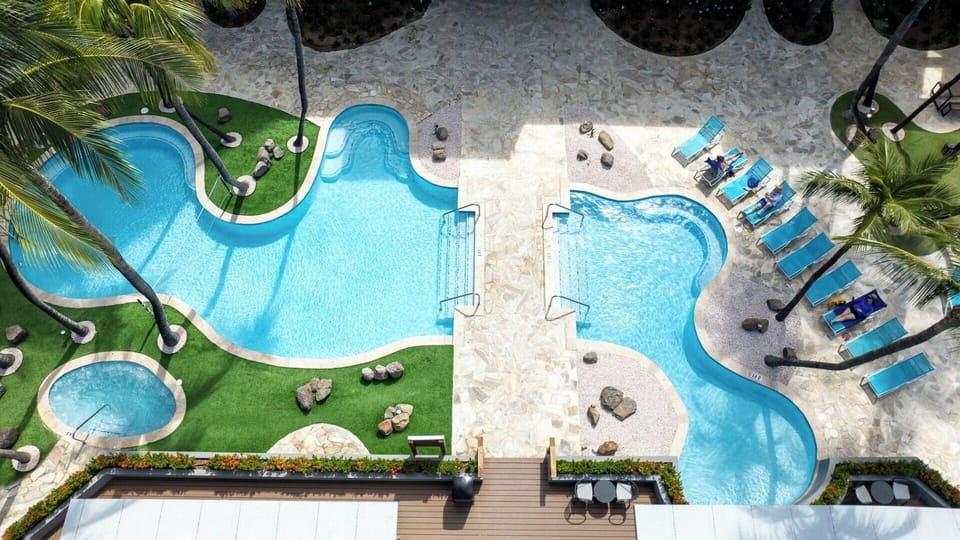 Soak up sunshine in a lagoon-style pool oasis below.