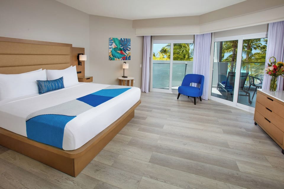 Wake refreshed beside palm views and a breezy private balcony.