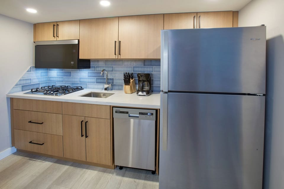 Cook with ease in a modern kitchen with full-size fridge.
