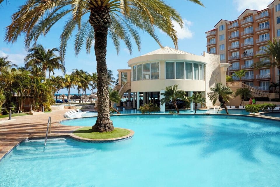 Dive into crystal-clear lagoons surrounded by swaying palms.