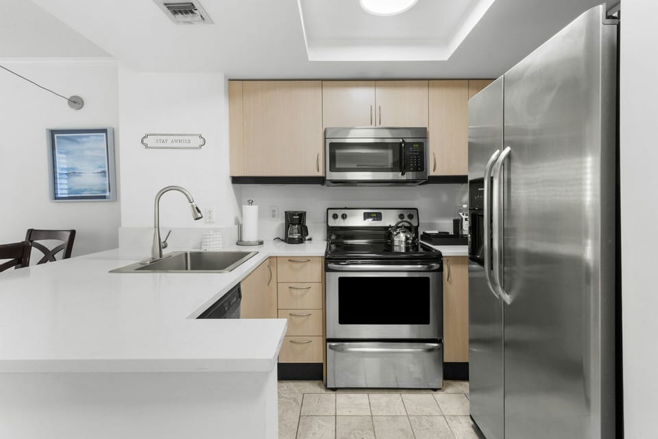 Cook with ease in the modern kitchen with stainless appliances.
