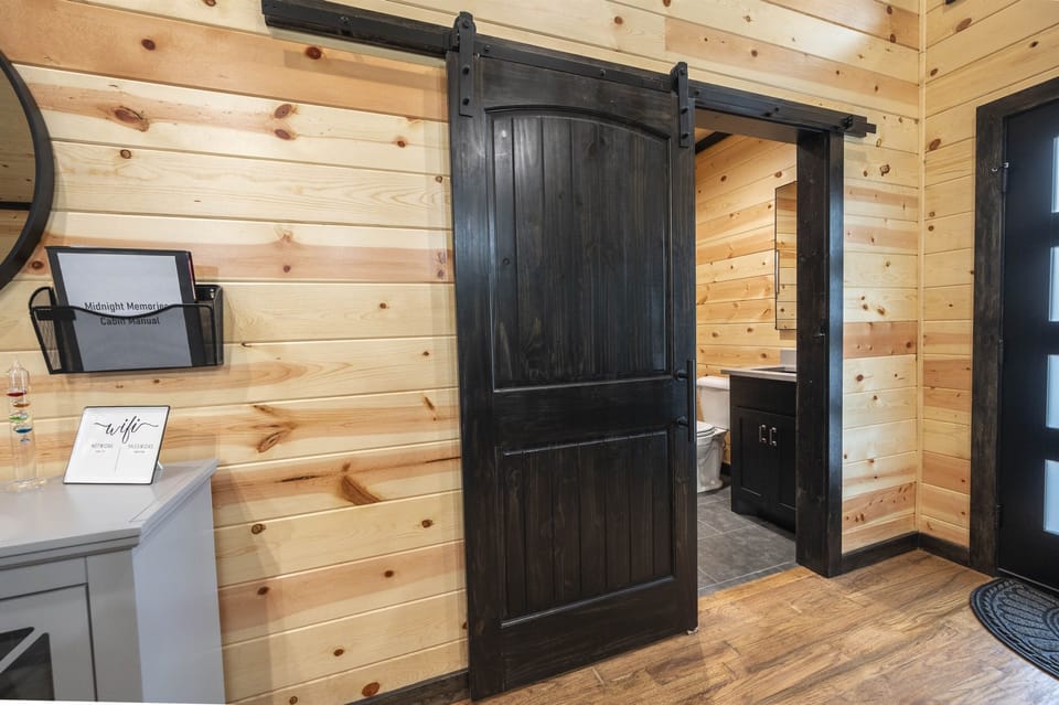 Off the kitchen is a half bath and laundry room with full size washer and dryer.