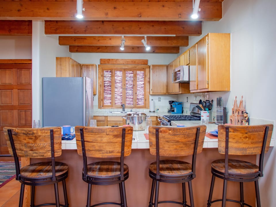 A kitchen with wooden beams.