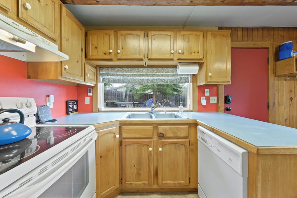 Cozy kitchen features beautiful wood paneling