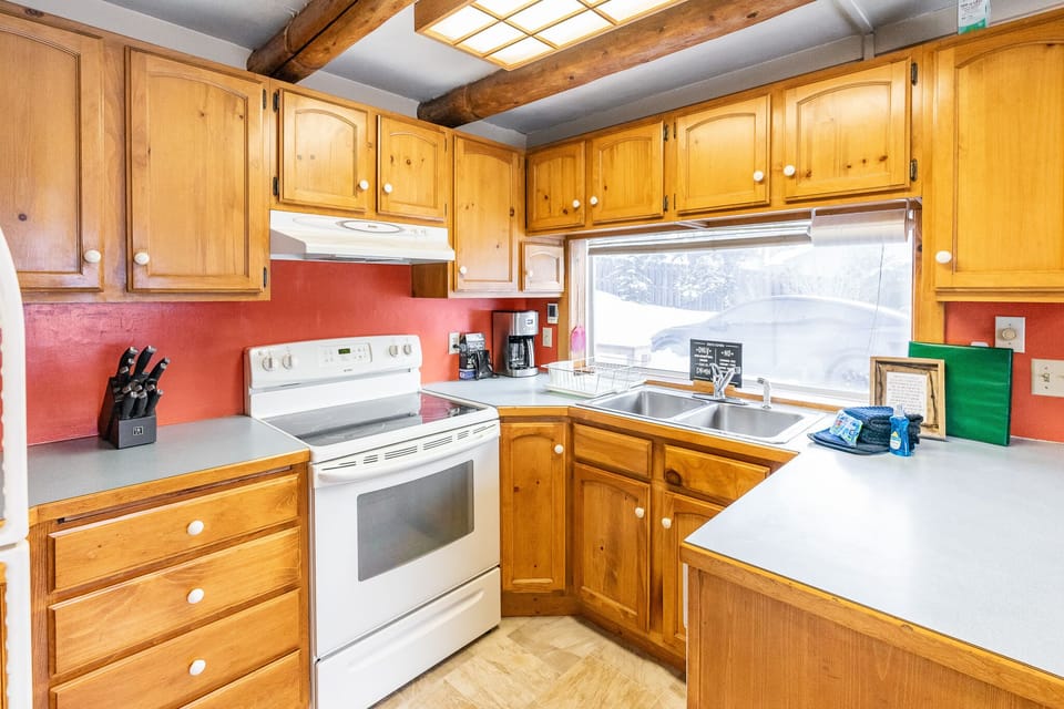 The kitchen door leads to the quaint outside deck.
