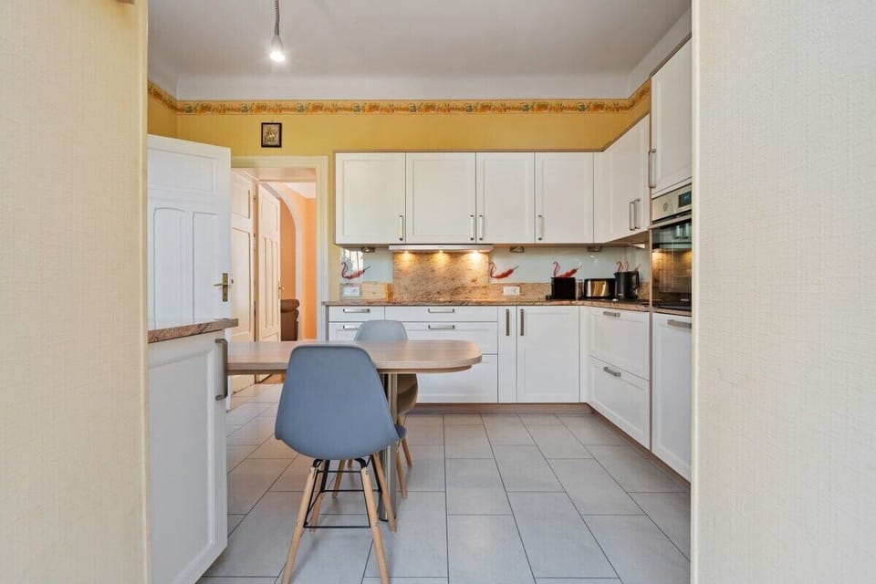 Modern meets function in this well-equipped kitchen, ready for your culinary adventures.