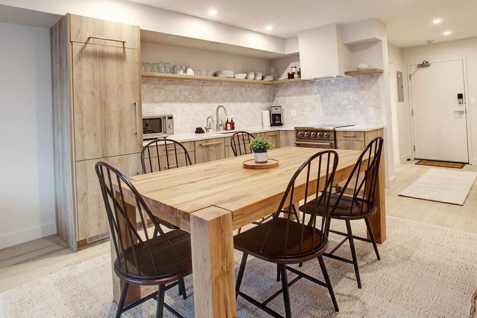 Dining room table, doubles as a convenient work space for those of you who like to work and play!  `Great place. Newly renovated and looks great. Right beside the valley trail and short walk to the gondola.`- Mike