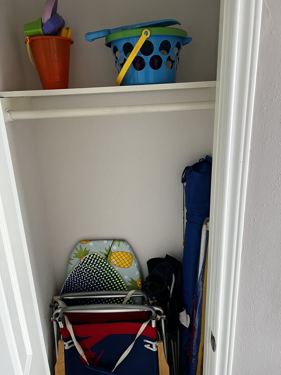 Beach chairs, umbrella, toys