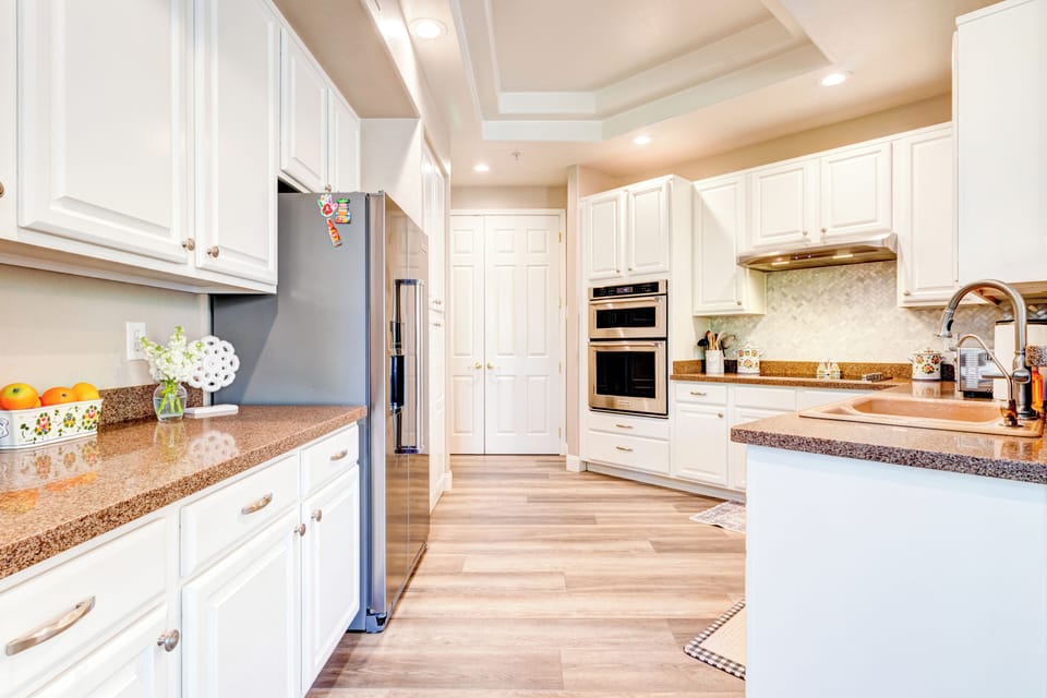 Expanded view of kitchen with new KitchenAid Appliances.