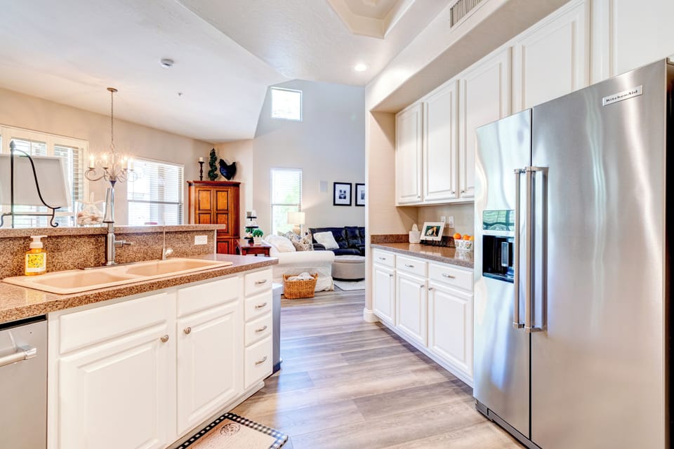 Side by side fridge/freezer. RO system at kitchen sink.