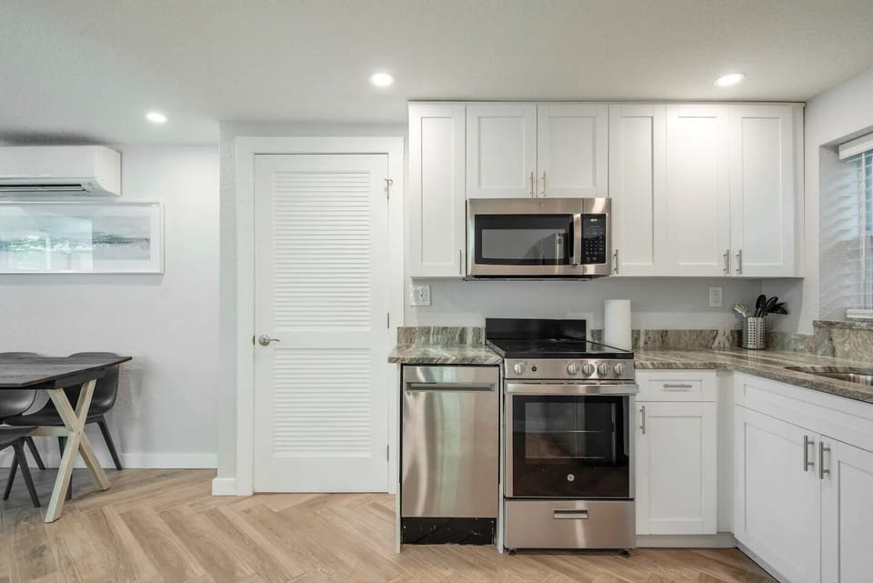 Full kitchen with appliances. 