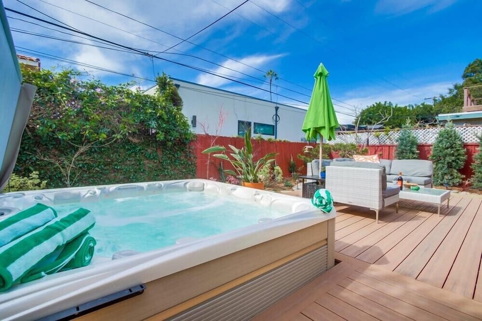 Hot Tub With Fountain And Lights For Evening Soaks.