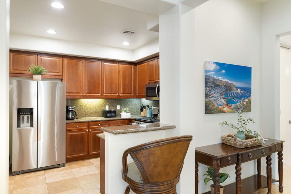 View into kitchen with conversation counter.
