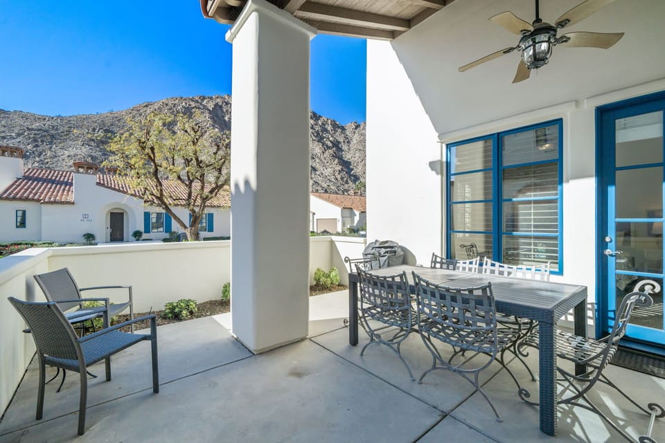 Enclosed sun-drenched patio with mountain views.