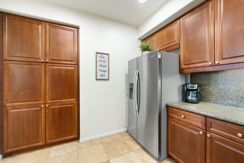 Full size fridge/freezer with filtered water and ice dispenser.