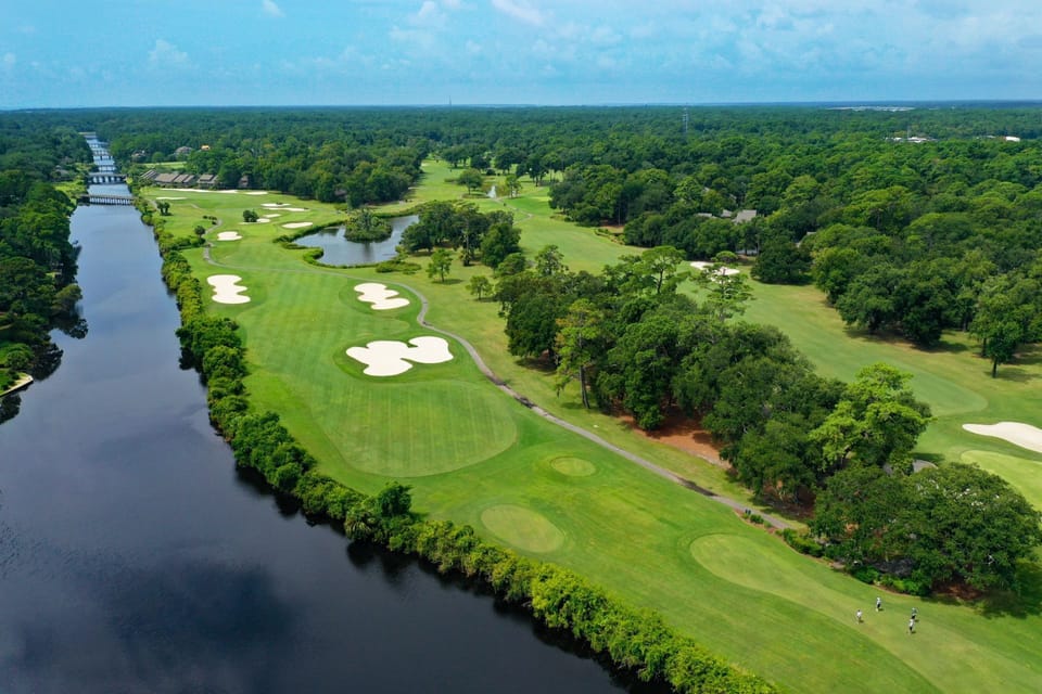 The community golf course offers expansive green space with manicured fairways and scenic views throughout.