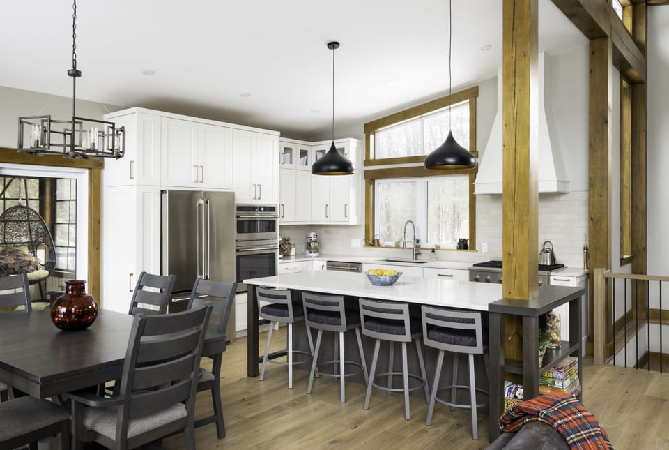 kitchen opens to the dining room with a table that extends for 12 people.