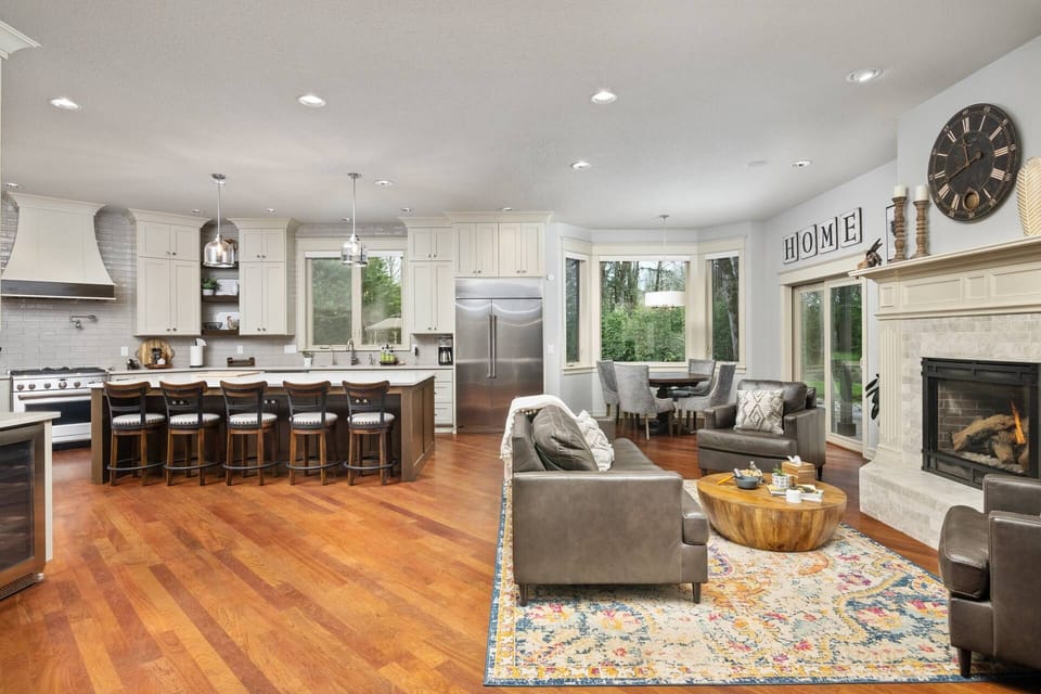 Fully stocked and massively upgraded kitchen that is any chef's dream along with a cozy sitting area next to the fireplace.
