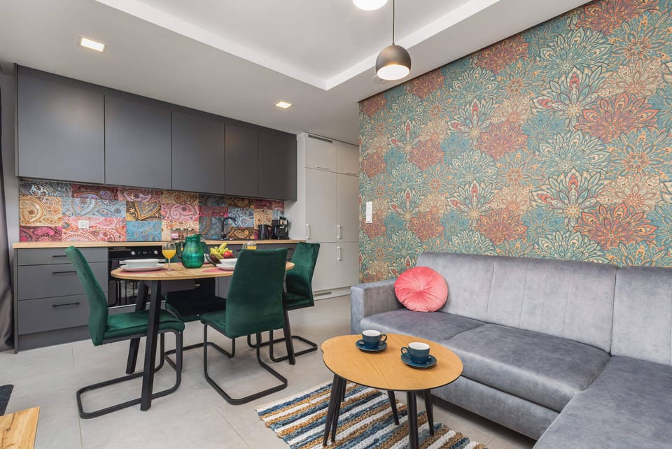 
A cozy corner of the living area, featuring a decorative wall and comfortable seating with soft cushions.
