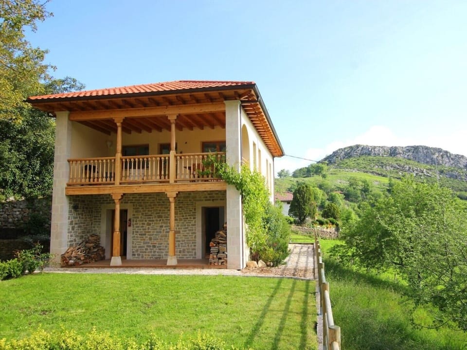 Front of the house with flat lawn area. 