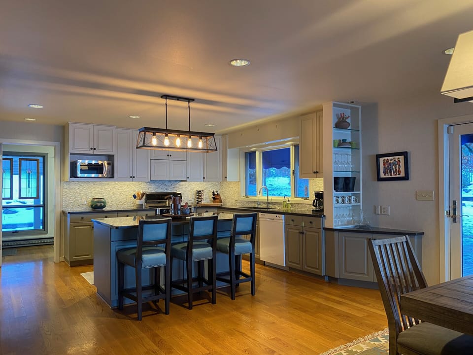 The renovated kitchen leads to the mudroom, deck and dining room.
