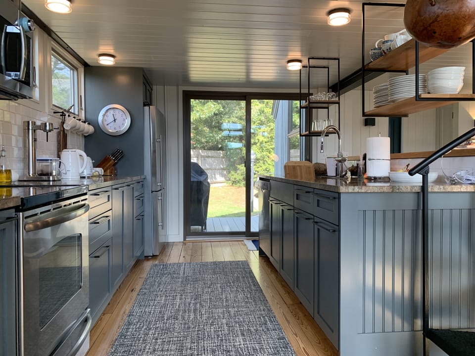 Expansive gourmet kitchen with granite counters and stainless steel appliances