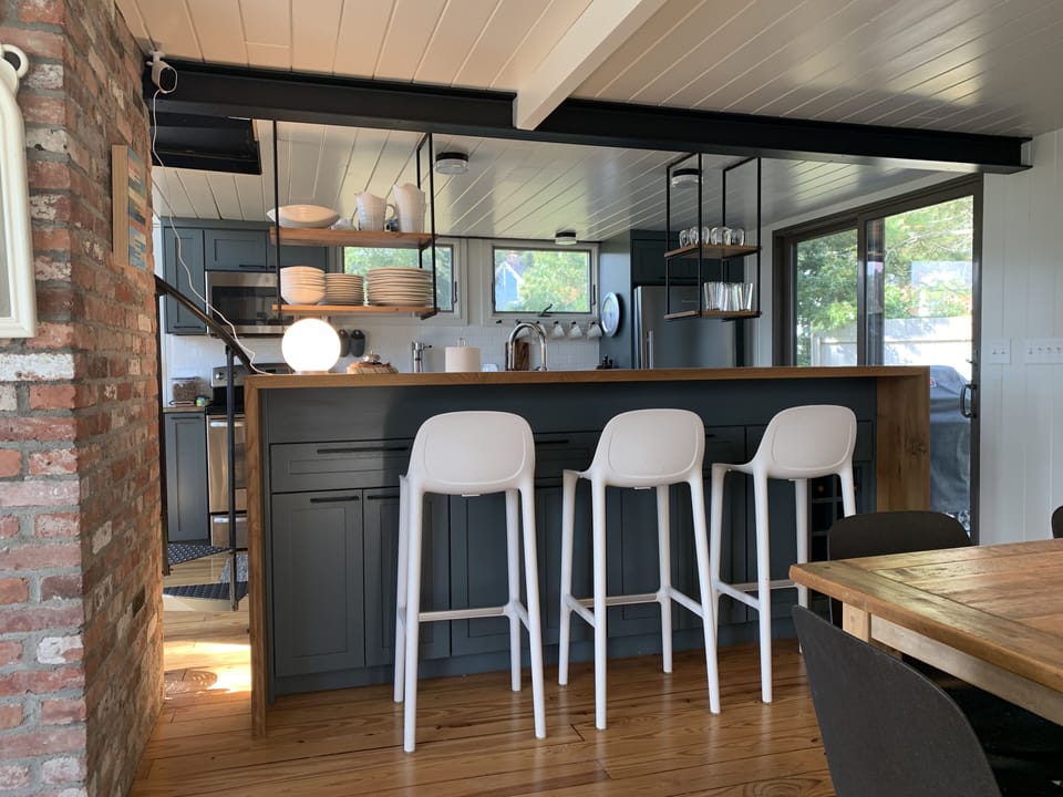 Kitchen island with rift sawn, white oak, waterfall counter