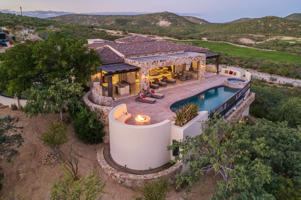 Bird's eye view of villa during sunset