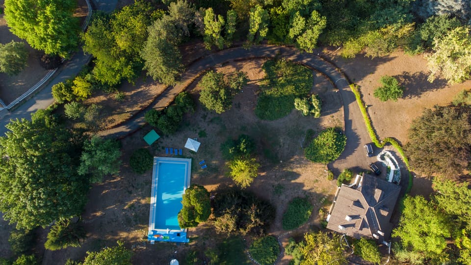 Aerial view:  private drive-the villa, Olympic private pool, tennis, grounds