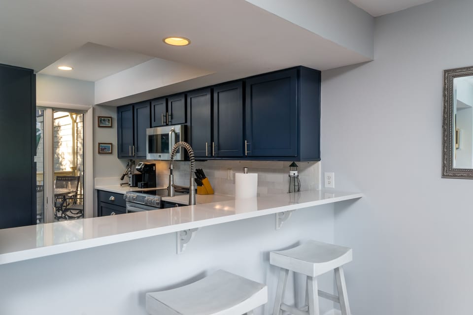 A breakfast bar and stools let you be part of the action.