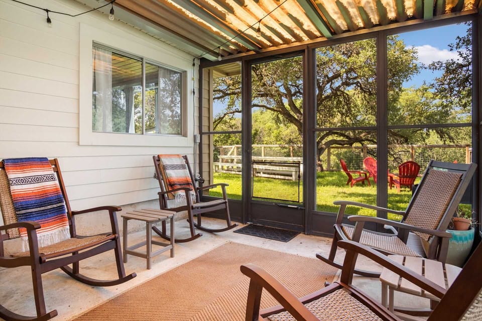 Enjoy a relaxing moment on a rocking chair in the cool breezes of the shaded and screened patio!
