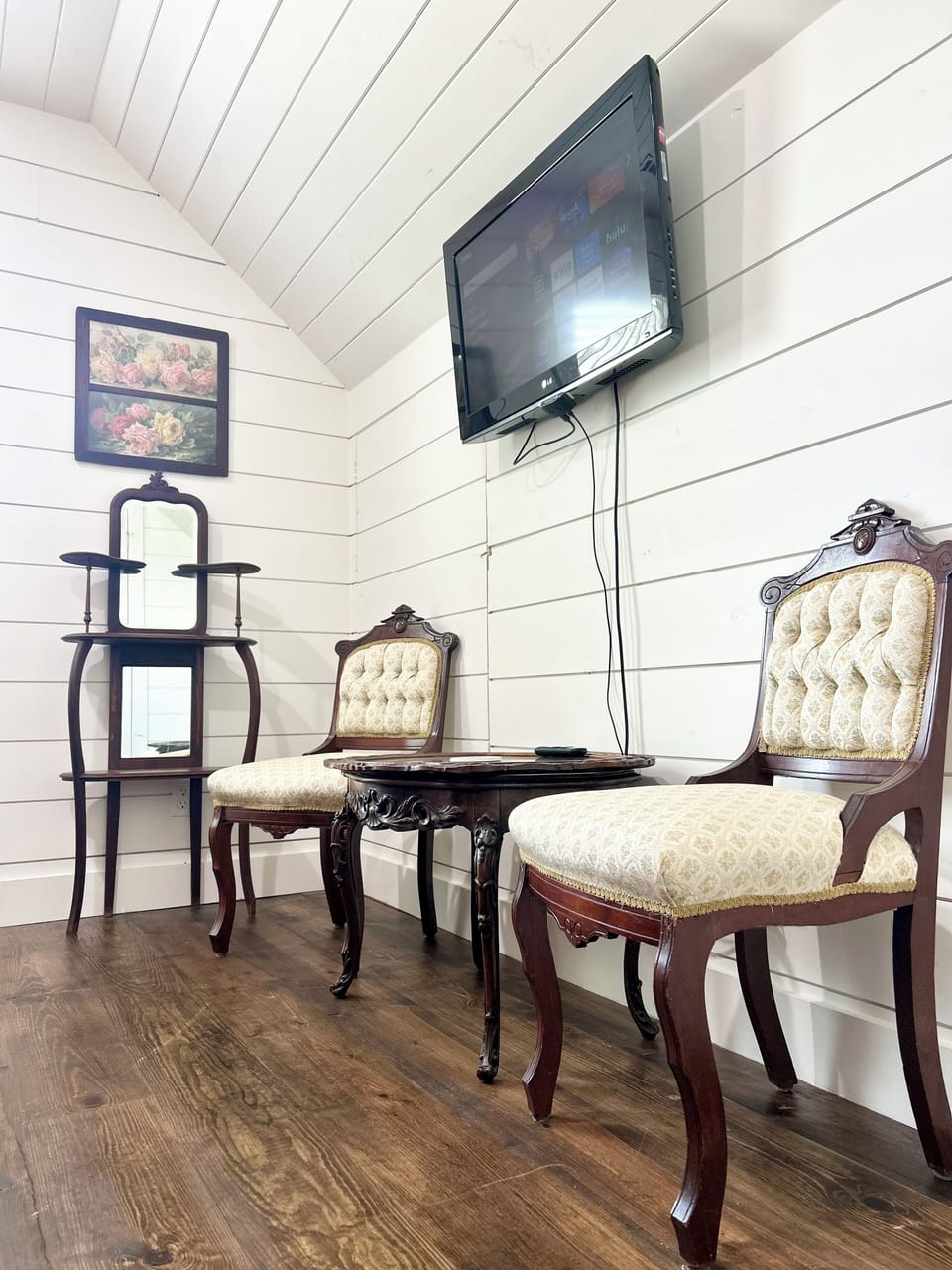 Upstairs bedroom 2 has an antique make up vanity and smart Roku tv.