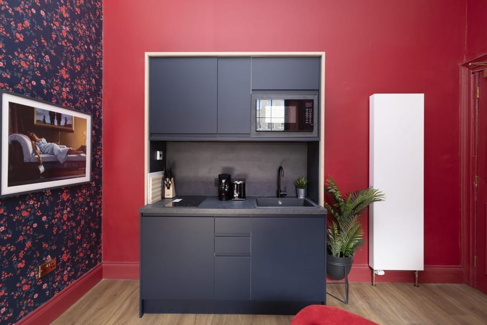 Studio with bed and kitchen
