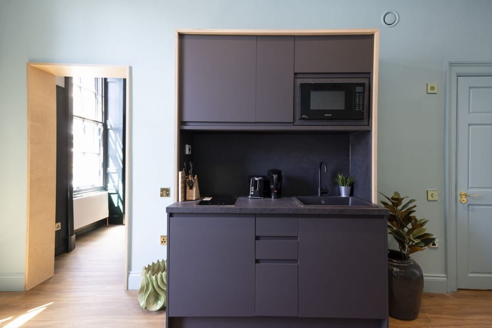 Studio with bed and kitchen