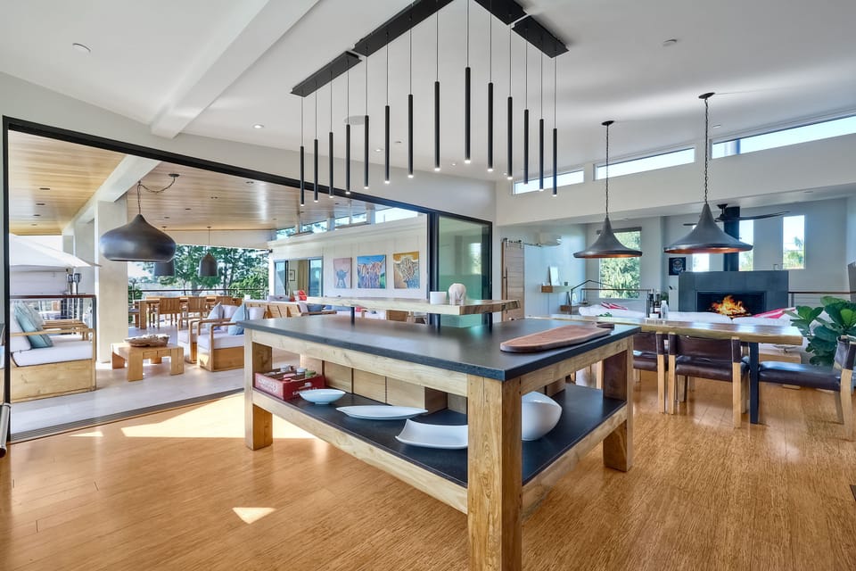 Gourmet kitchen, fully stocked for all your cooking needs and a custom island with a live edge counter and bar seating for 4