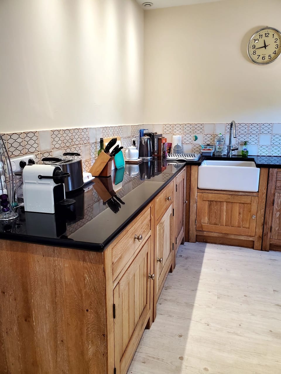 Kitchen showing Nespresso machine, toaster, knife rack and kettle