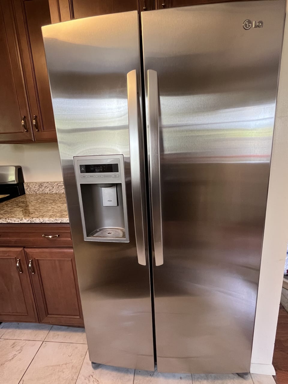 LG side-by-side stainless steel refrigerator with icemaker