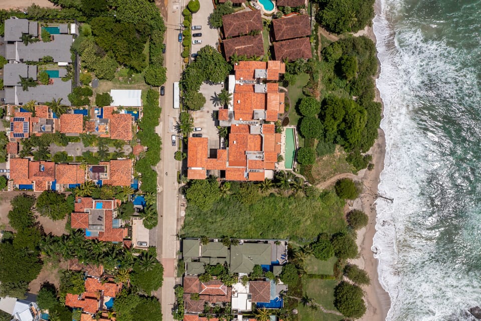 we are the smaller blue swimming pool by the road, just steps to the beach.