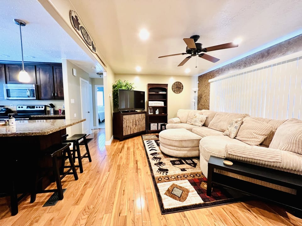 Cozy Great room, modern kitchen/ living room area. Nice appliances and seating. 