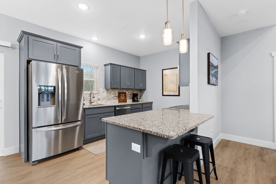 There is extra seating at the kitchen bar. 