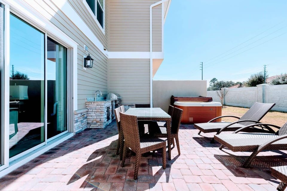 Step onto the patio, where comfortable furniture and sun loungers await you, alongside a summer kitchen for al fresco dining and a jacuzzi for ultimate relaxation
