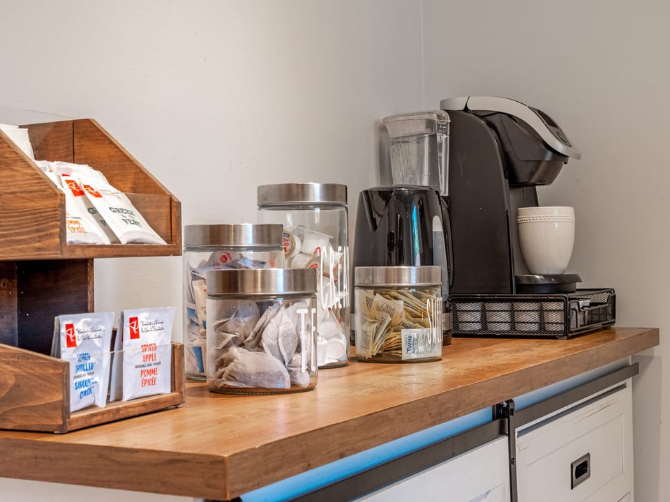Coffee station with kcups, variety of teas, kettle, and sugars