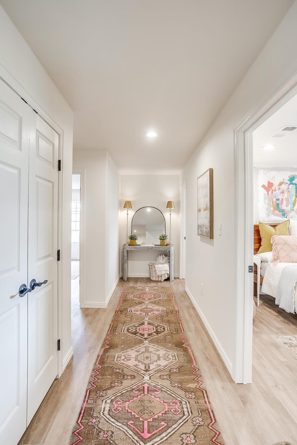 Interior hallway with antique rug at The Blanc lakefront home
