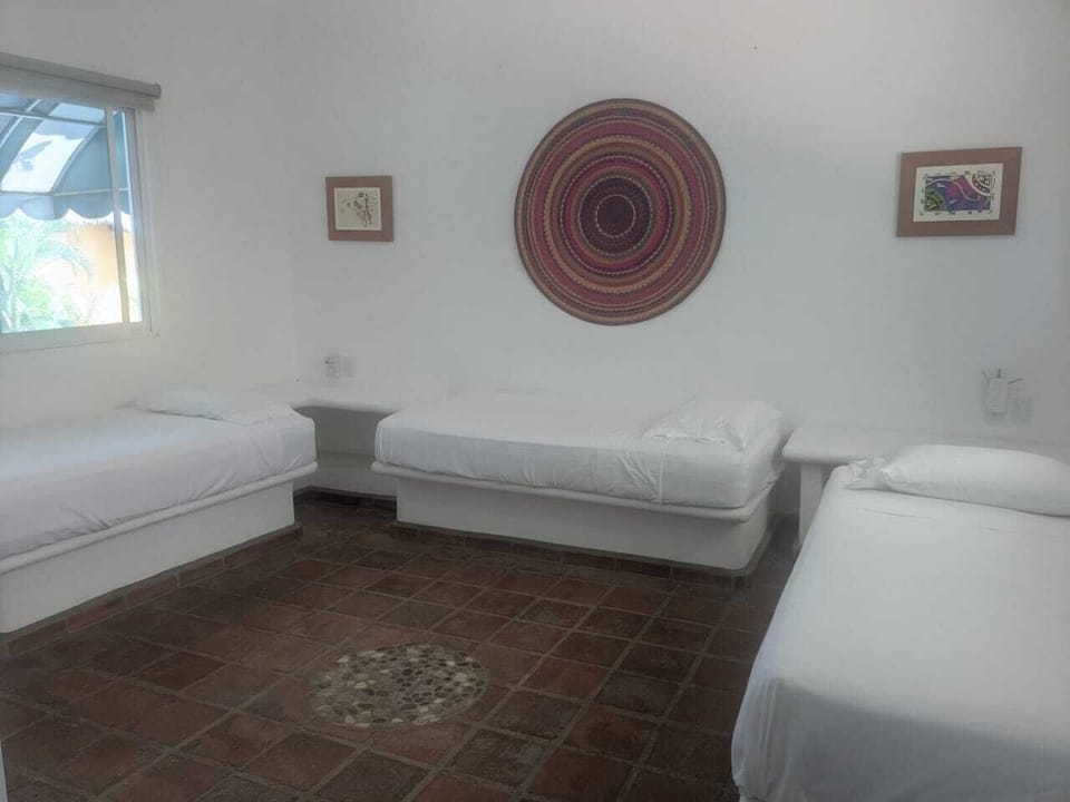 3rd bedroom has 3 twin size beds and its own bathroom. Please note there is no air conditioning 