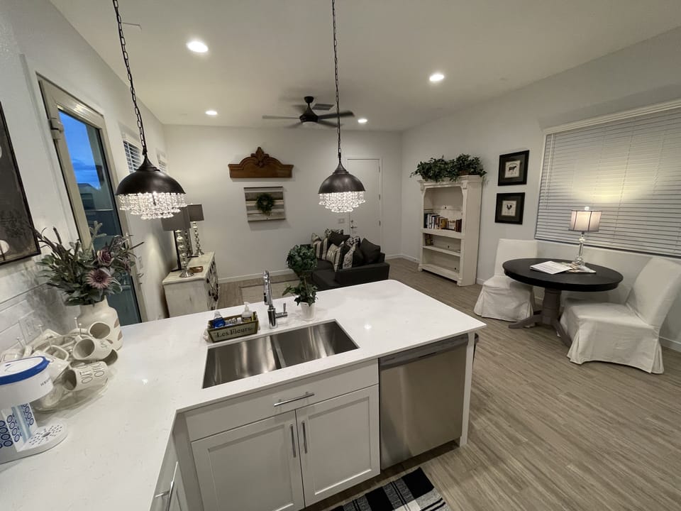 Full kitchen w/ open layout looking towards living room. Fully stocked kitchen!