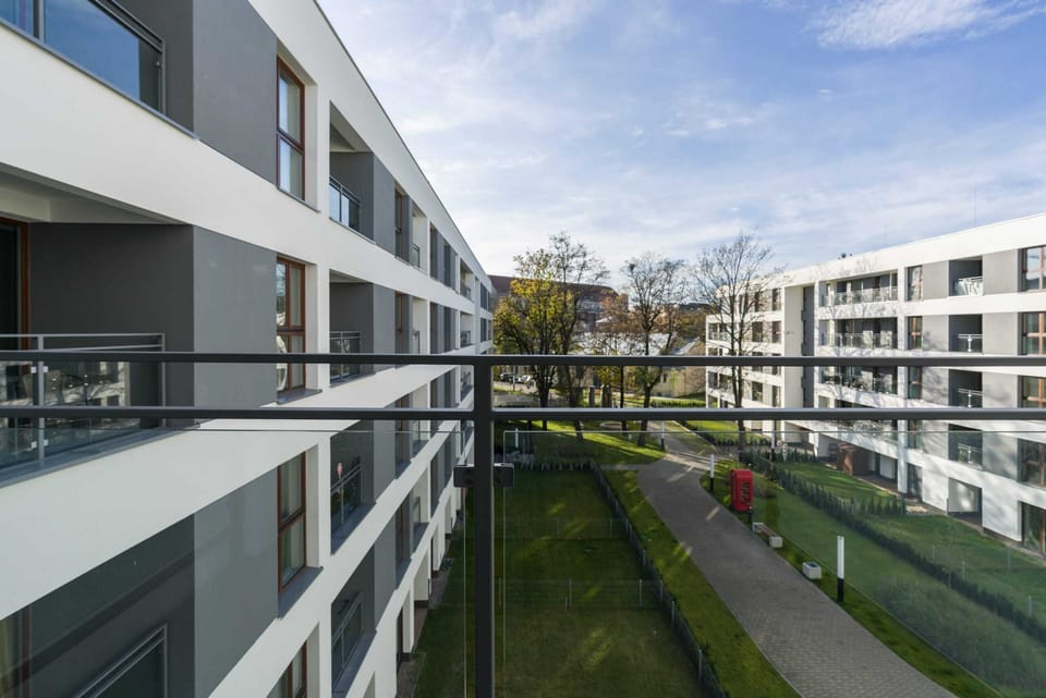 A balcony view showcasing the open and airy residential complex.
