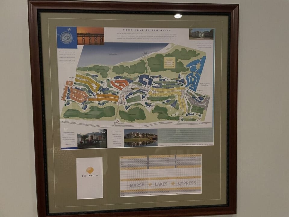 Framed Map of Peninsula grounds in Living Room.  Good for golfing, bike riding.